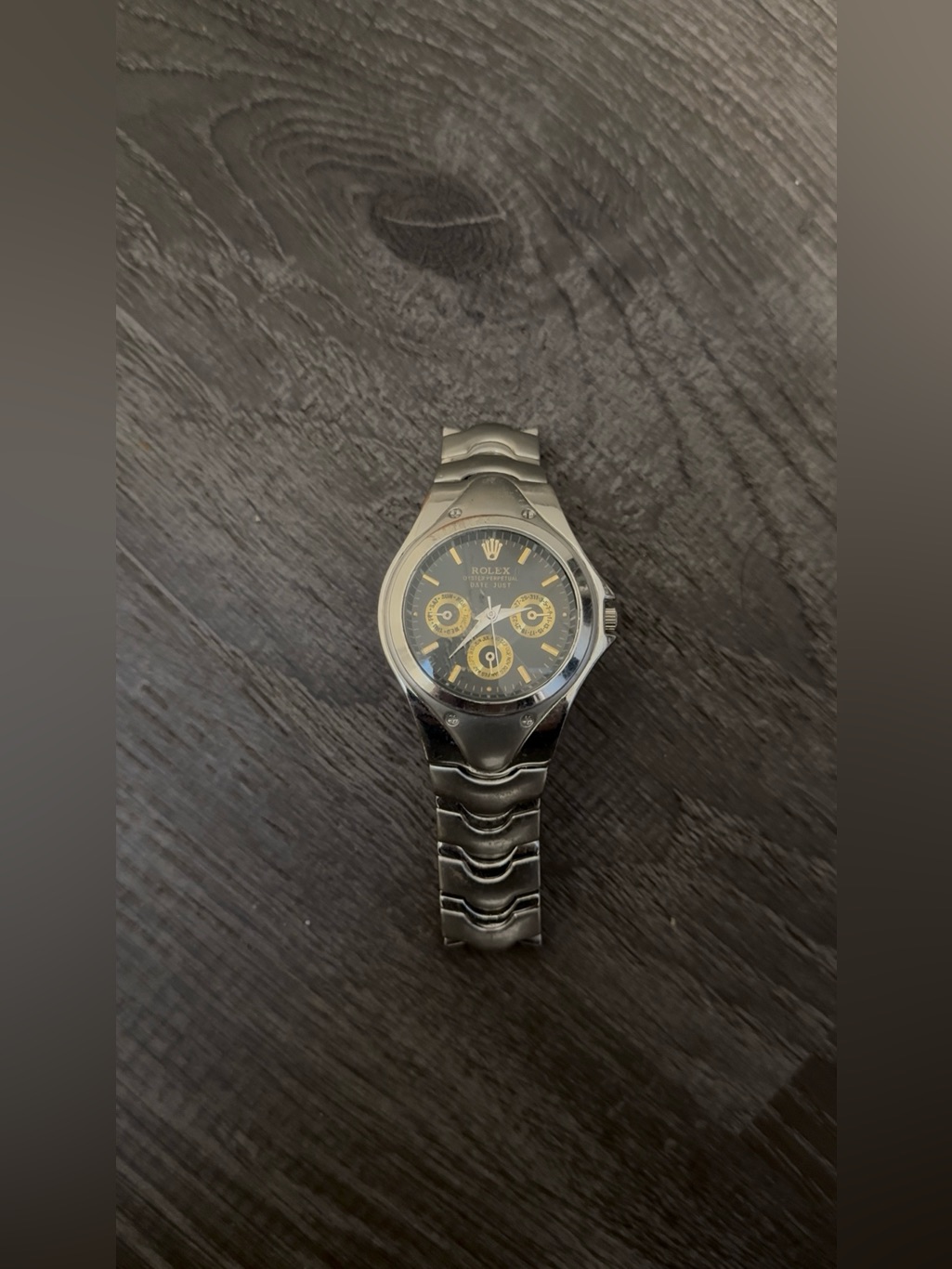Silver Watch With Black Dial And Gold Accents